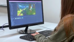 Young girl coding a 3D game