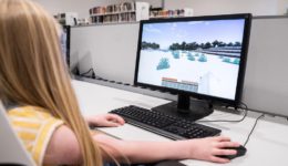 Young girl playing Minecraft